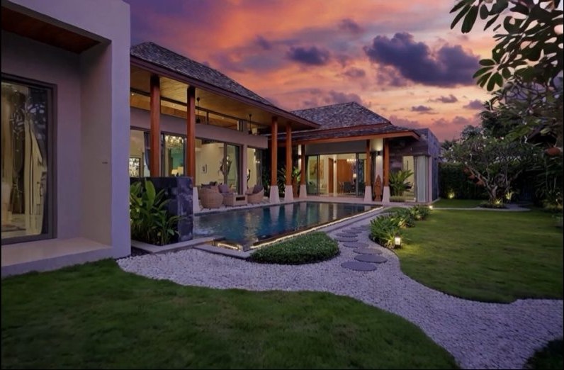 Botanica Hillside villa and private pool beneath a vivid Phuket sunset