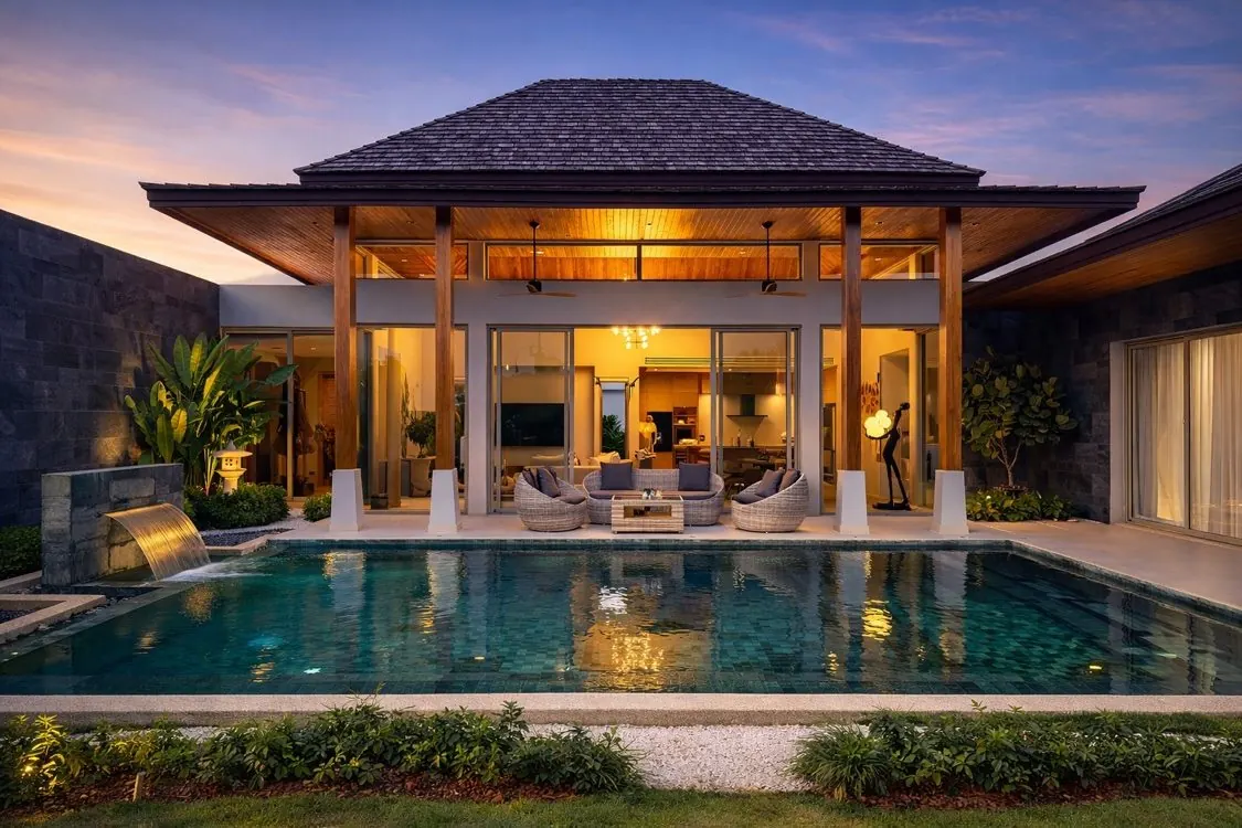 Pool and pavilion illuminated at night