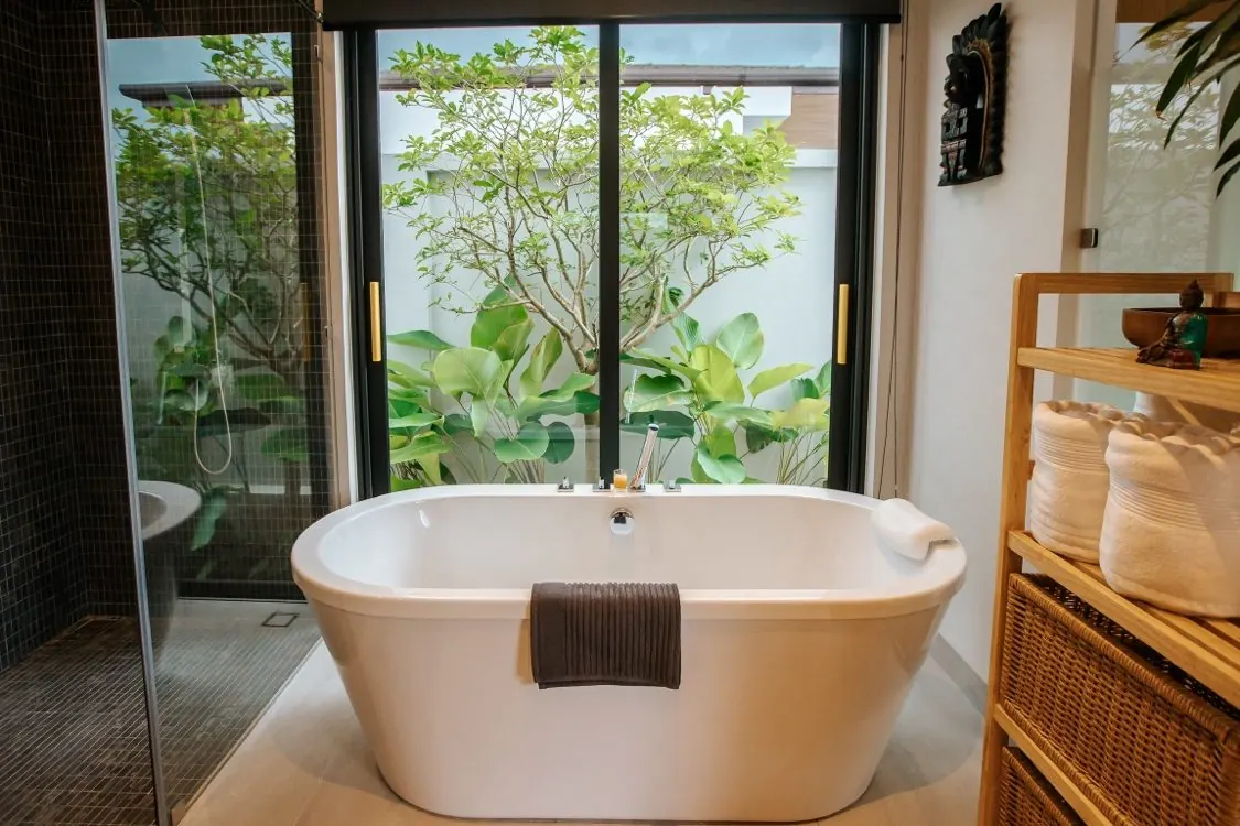 Soaking tub beside garden doors